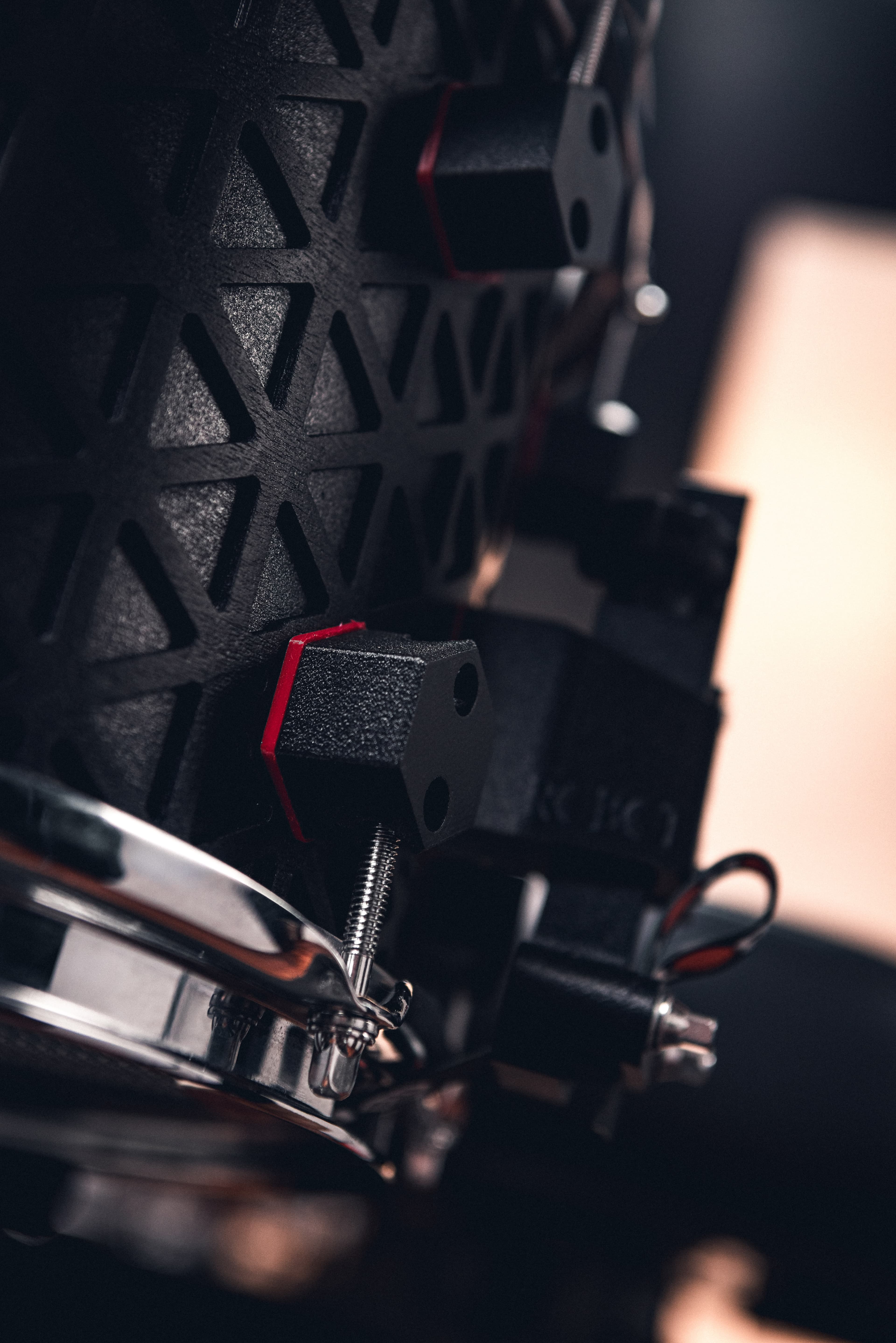 Robot drums arranged in a studio shelf.