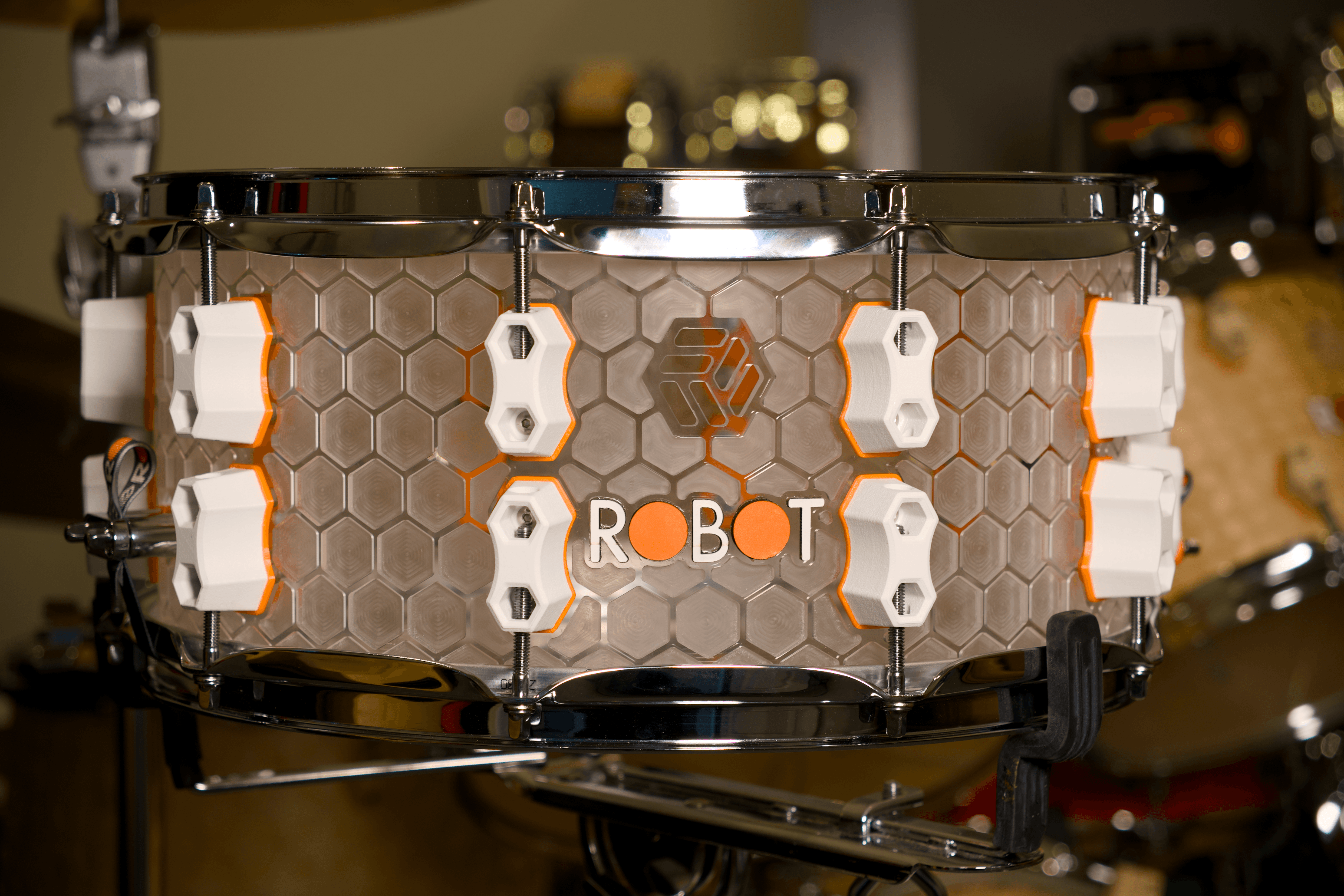 Clear Hive snare with honeycomb shell and white hardware.