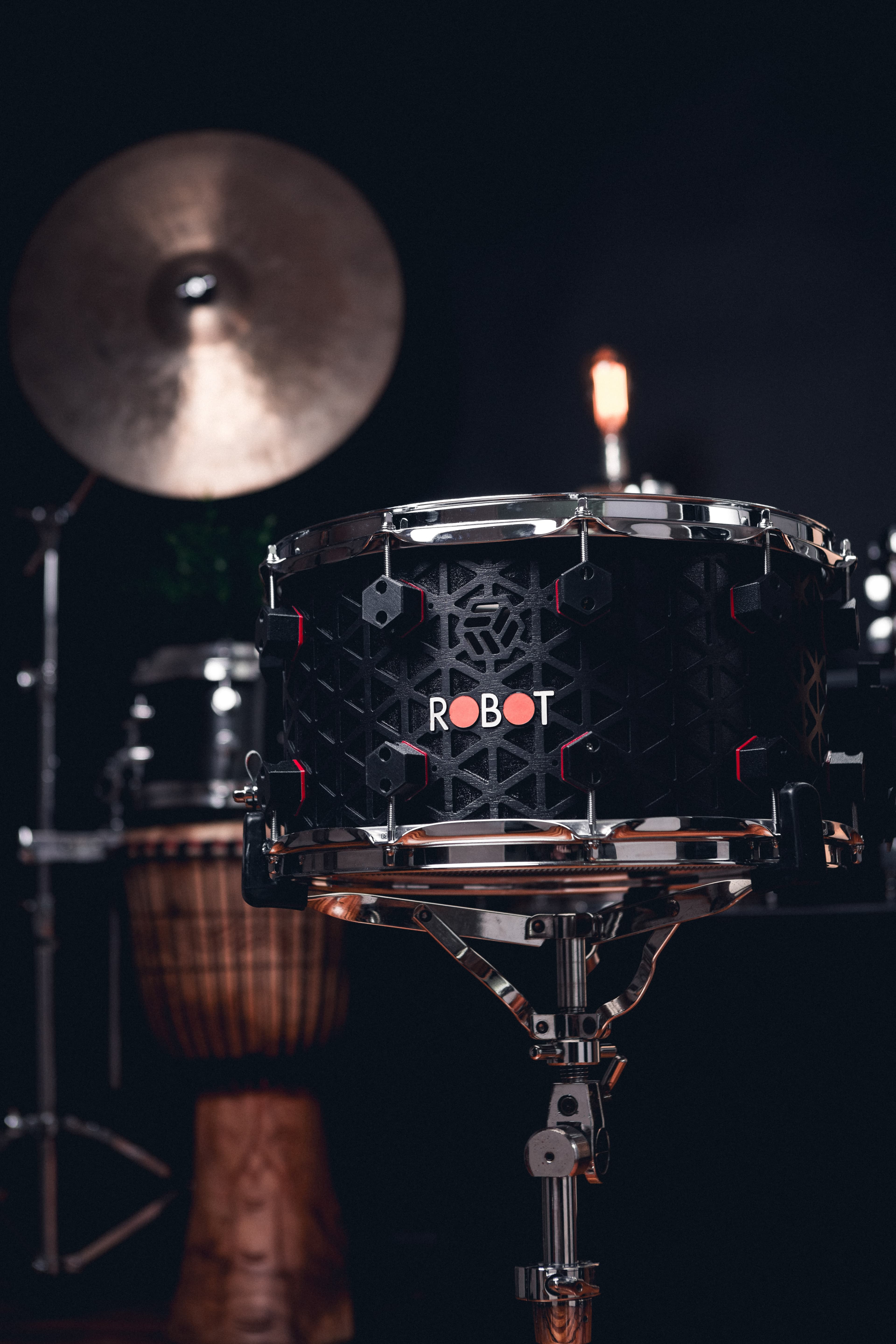 Kumiko Series snare on stage with an isogrid shell and chrome hardware.